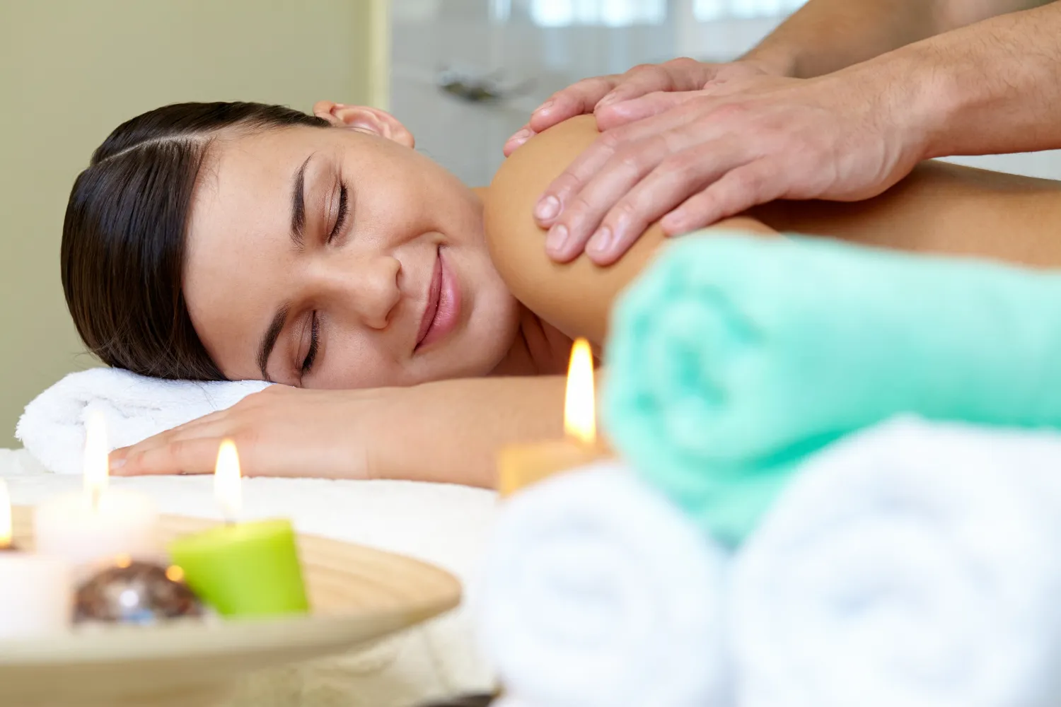 Professional masseur performing a relaxing full body massage
