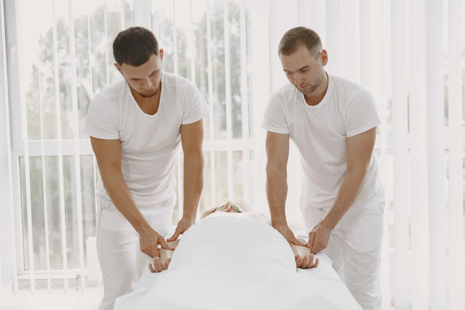 Professional four hands massage services by two therapists