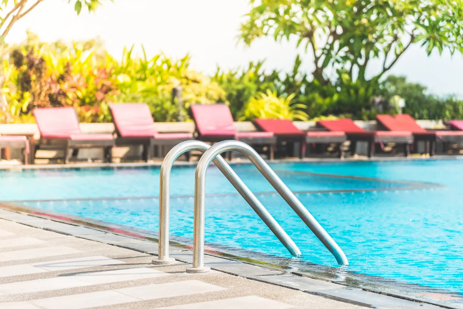 Luxury pool access in Dubai with infinity pool and lounge area