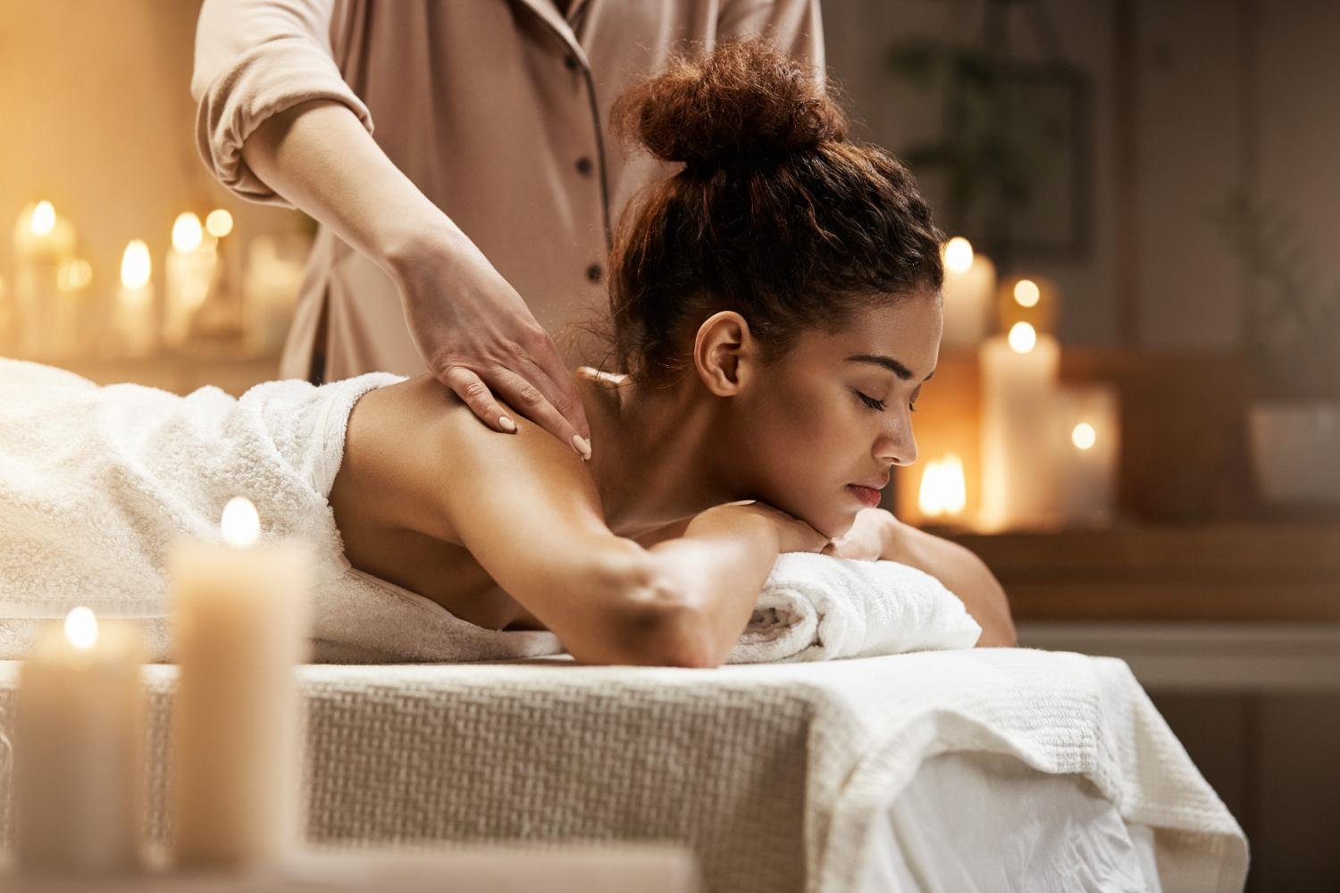 Therapist setting up for a home massage in Downtown Dubai